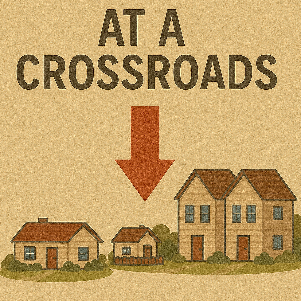 Three houses—one small, one mid-sized, and one duplex—are arranged beneath a large red downward arrow and the phrase “At a Crossroads,” representing the divergent future paths for housing policy and affordability.